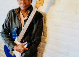 Robert Cray Standing Up with Guitar